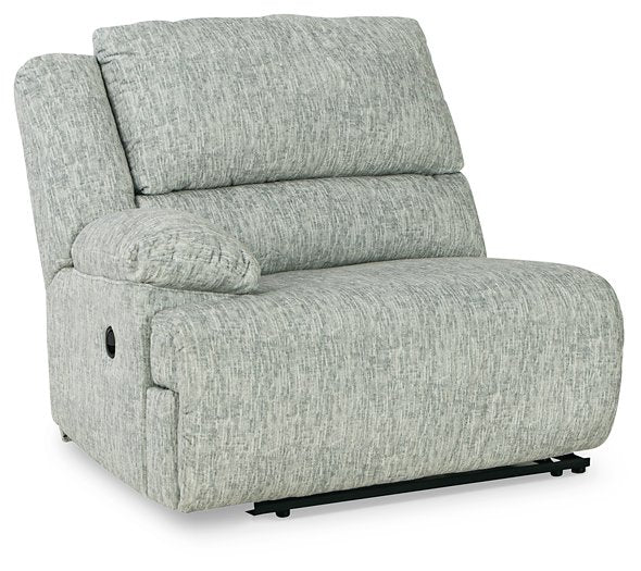 McClelland Reclining Sectional Loveseat with Console Half Price Furniture