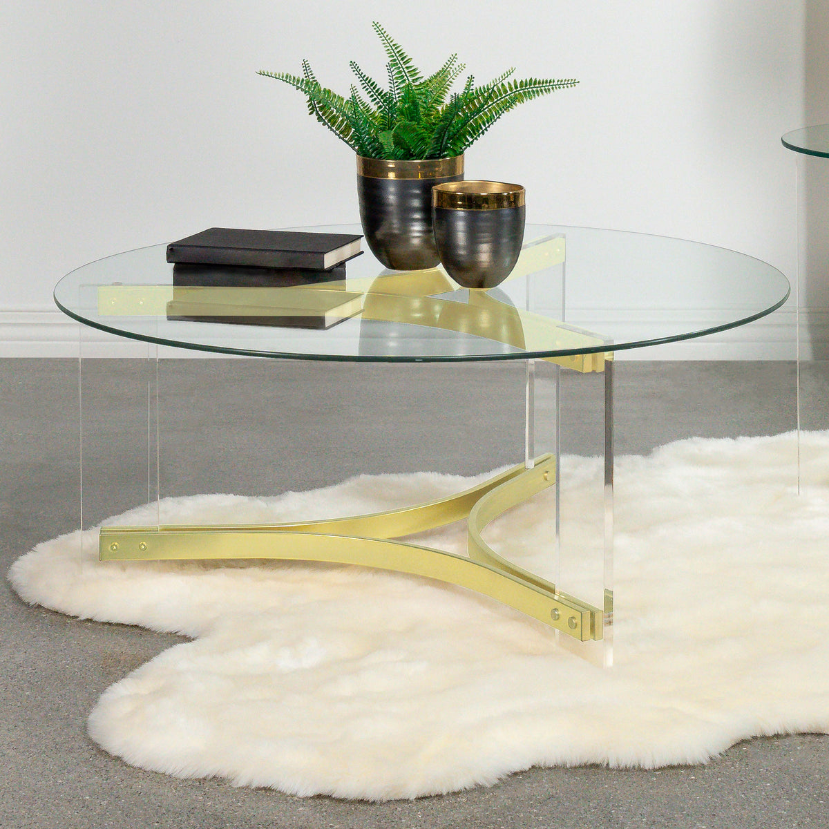 Janessa Round Glass Top Coffee Table With Acrylic Legs Clear and Matte Brass Janessa Round Glass Top Coffee Table With Acrylic Legs Clear and Matte Brass Half Price Furniture