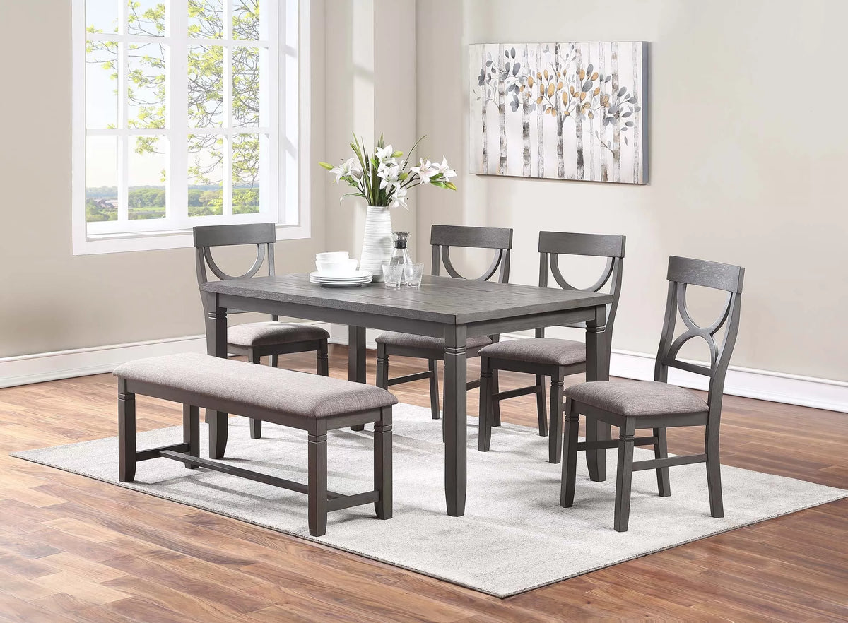6 Pc grey curved-back dining set with bench and 4 chairs in a dining room