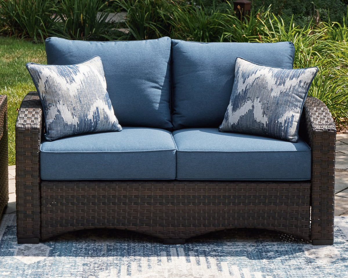 Windglow Outdoor Loveseat with Cushion  Half Price Furniture