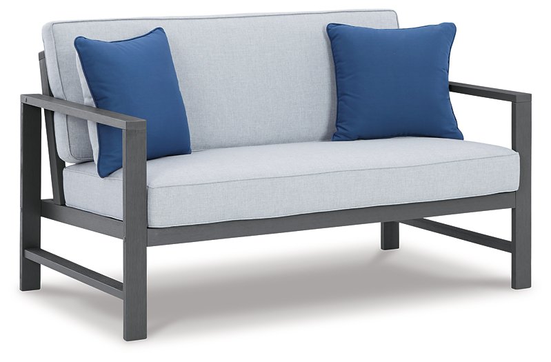 Fynnegan Outdoor Loveseat with Table (Set of 2) - Half Price Furniture