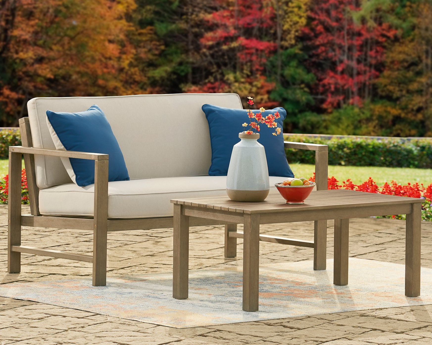 Fynnegan Outdoor Loveseat with Table (Set of 2) - Half Price Furniture