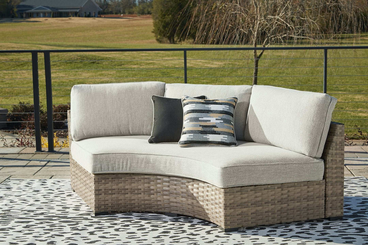 Calworth Outdoor Curved Loveseat with Cushion - Outdoor Seating - Half Price Furniture