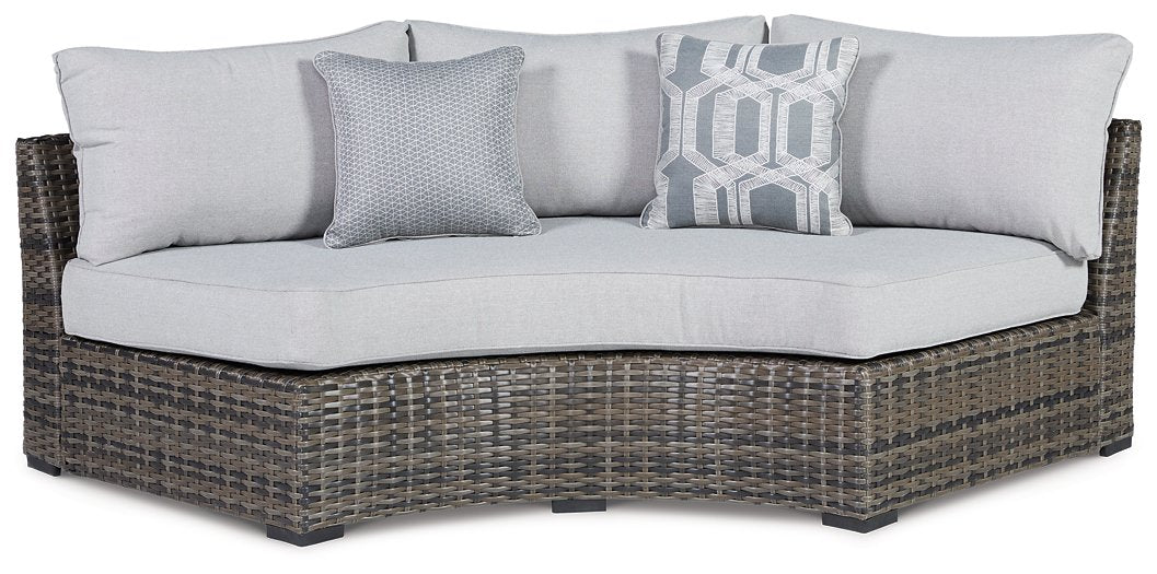 Harbor Court Curved Loveseat with Cushion  Half Price Furniture