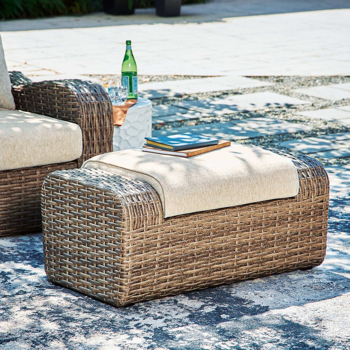 Sandy Bloom Outdoor Ottoman with Cushion Half Price Furniture
