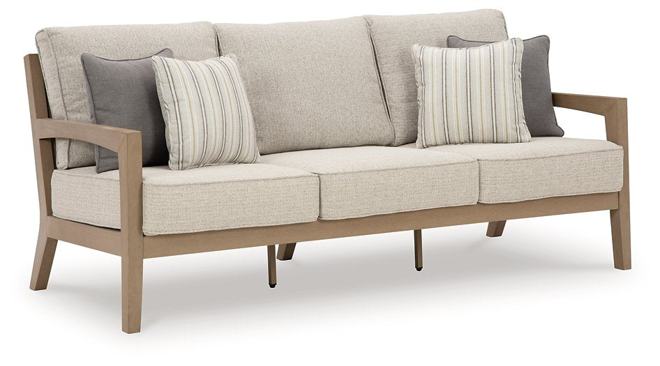 Hallow Creek Outdoor Sofa with Cushion Half Price Furniture