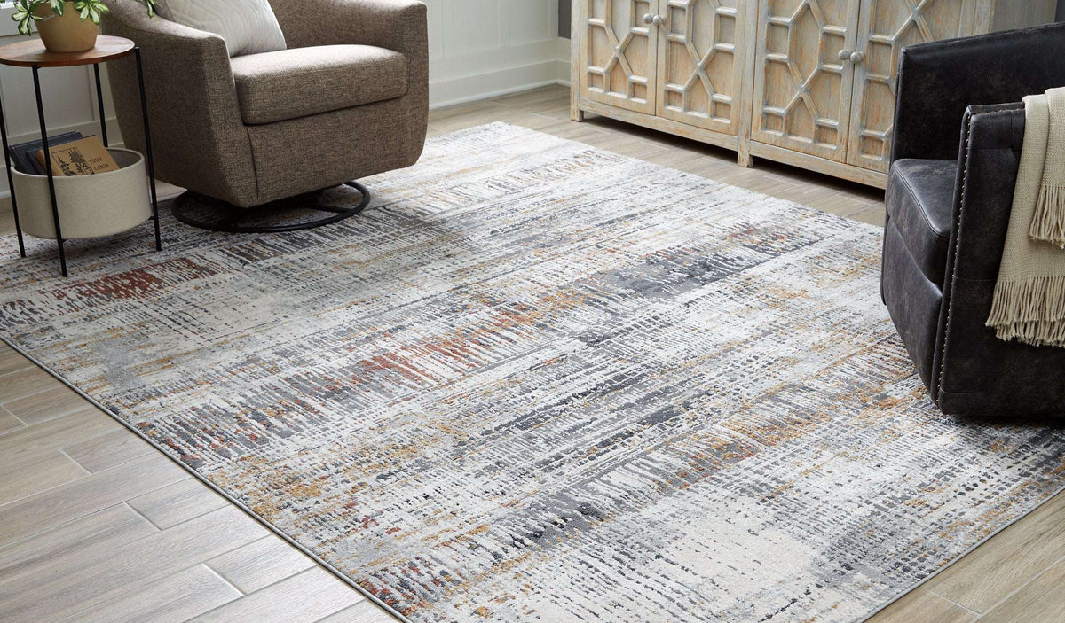 Rhettner 7'10" x 9'10" Rug Half Price Furniture