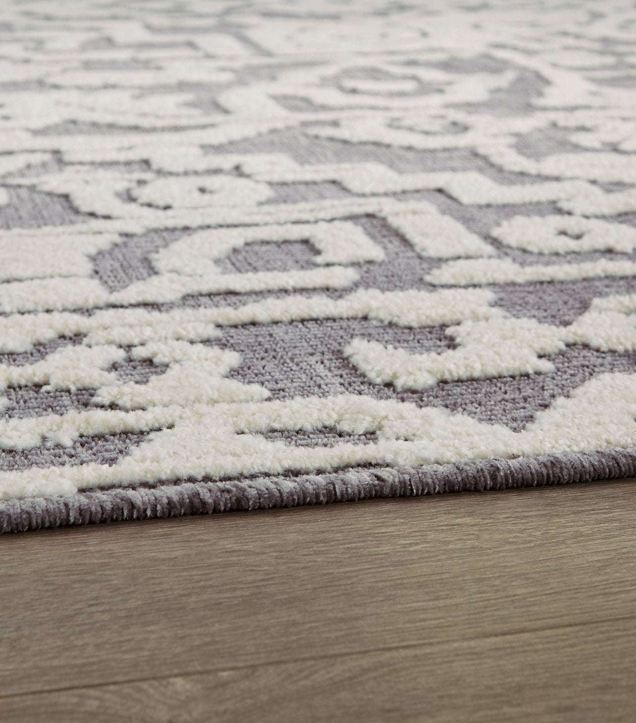 Oddetteley 7'10" x 10'1" Rug Half Price Furniture