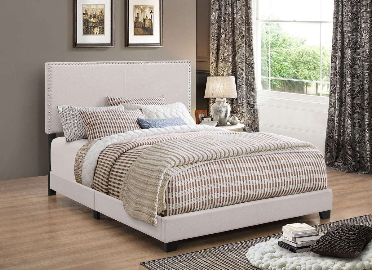 Boyd Eastern King Upholstered Bed with Nailhead Trim Ivory  Half Price Furniture