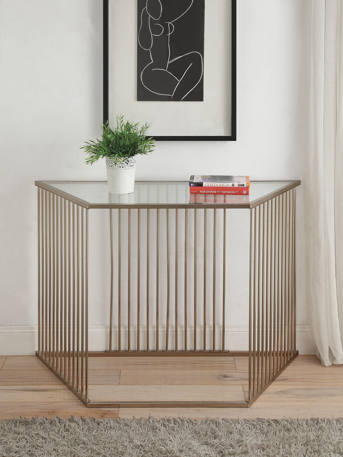 Oaklie Champagne & Clear Glass Sofa Table Half Price Furniture