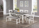 6 Pc white and grey two-tone dining set with bench and 4 chairs in a dining room