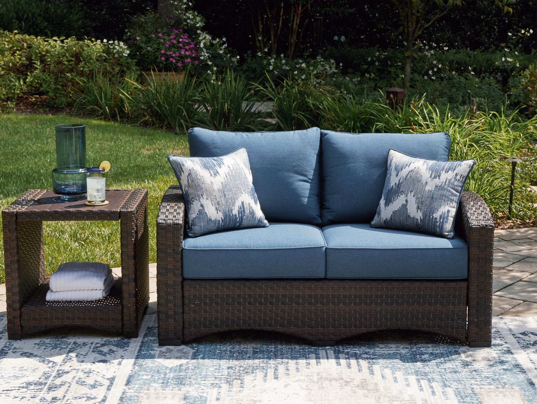 Windglow Outdoor Loveseat with Cushion - Half Price Furniture
