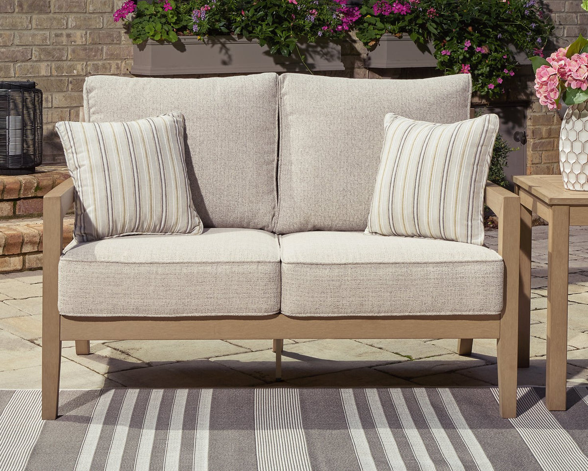 Hallow Creek Outdoor Loveseat with Cushion - Half Price Furniture