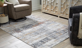 Rhettner 5'3" x 7'3" Rug - Half Price Furniture