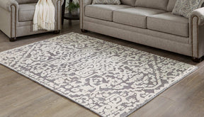 Oddetteley 4'11" x 7'2" Rug - Half Price Furniture