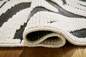 Thomwith 4'11" x 7'2" Rug - Half Price Furniture